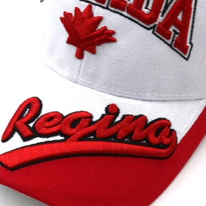 Close-up of premium Canada baseball cap featuring red maple leaf and Regina embroidery