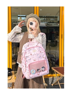 Detail of pink polka dot backpack with dachshund print and transparent front pocket