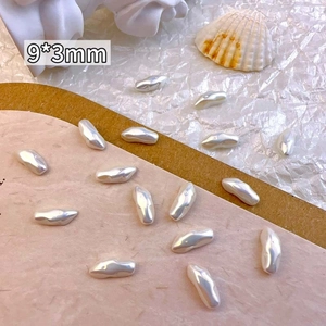Macro shot of 9x3mm irregular baroque pearl beads for nail art and jewelry design