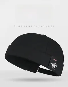Detail of black cotton Miki Hat featuring side polo logo patch and adjustable strap