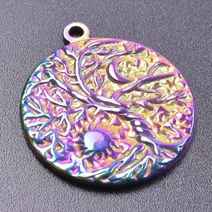Macro view of rainbow plated Tree of Life sun and moon pendant in 18K gold stainless steel