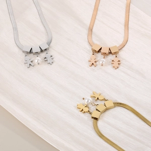 Flat snake chain necklace with pearl and child pendants in gold, silver, and rose gold