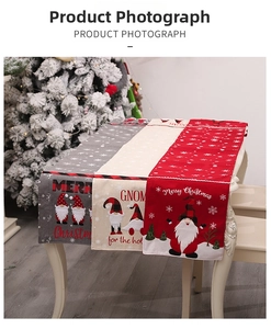 Detail of Christmas table runners featuring gnome motifs and Merry Christmas embroidery