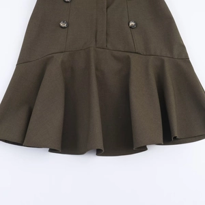 Detail of dark olive short dress featuring double-breasted buttons and ruffled hemline