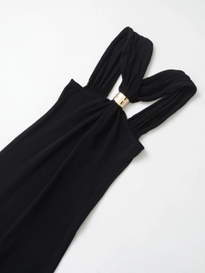 Detail of knit halter dress featuring gold metal ring accents on the neckline