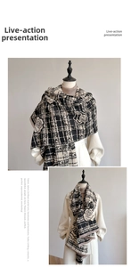 Close-up of black and white rose pattern cashmere-like scarf with classic plaid texture