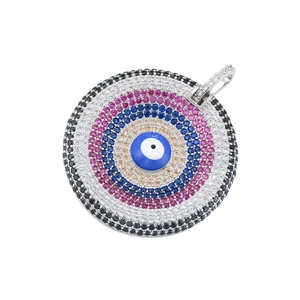 Macro view of iced-out evil eye heart pendant with multi-color micro-paved crystals