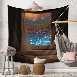 Detail of bohemian tapestry featuring a sea view through a window in a modern room