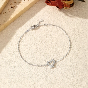 S925 sterling silver heart bracelet with sparkling VVS1 moissanite in a romantic setting
