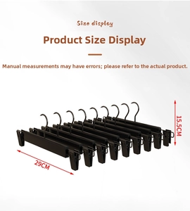 Detailed size view of matte black adjustable pants hanger with dimensions 29cm by 15.5cm