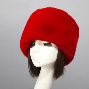 Detail of red faux fur Cossack hat with thick fluffy texture on a model head