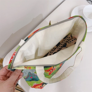 Top view of canvas tote bag with floral print showing zipper closure and spacious interior