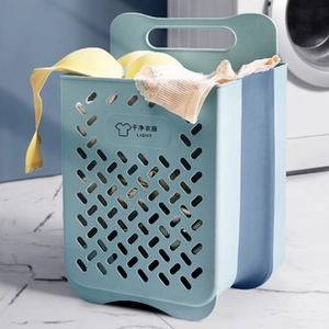 Blue foldable laundry basket with handle and ventilation holes shown in a laundry room