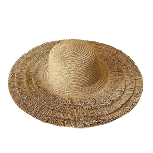 Wide brim straw hat with fringe edge for summer beach sun protection and vacation style