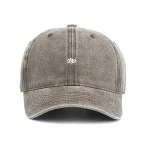 Detailed view of white letter R embroidery on vintage washed cotton baseball cap