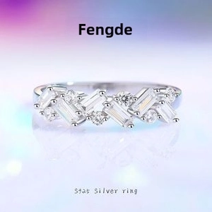 Detail of S925 sterling silver V-shaped crown ring with baguette and round cut zircons