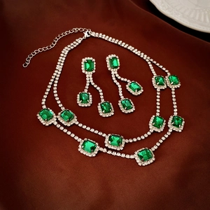 Elegant emerald green double layer necklace and earring set with shimmering silver crystals