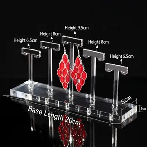 Five-tier T-bar acrylic earring display stand with tiered hooks and a clear base