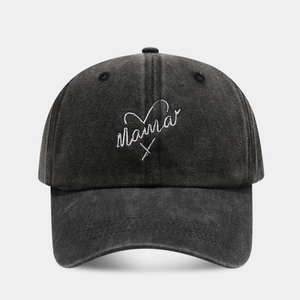 Close-up of Mama embroidery and heart on a washed black cotton baseball cap