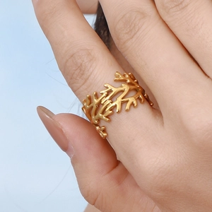 Golden coral branch stainless steel ring worn on finger with minimalist design