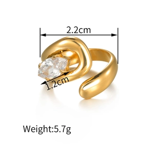 Macro shot of gold asymmetric ring showing dimensions 2.2cm width and 5.7g weight