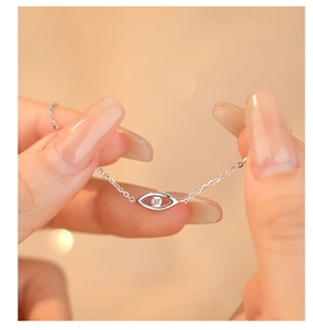 Close-up of S925 sterling silver evil eye bracelet with sparkling cubic zirconia stone