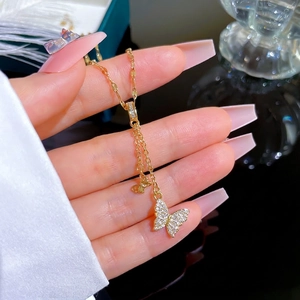 Elegant 18K gold-plated double butterfly pendant necklace with pavé zircon accents