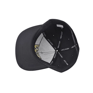 Detail view of cotton baseball cap interior with NEW CAP tape and washing labels