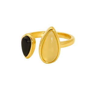 Detail of gold open ring with black onyx and smoky quartz teardrop stones