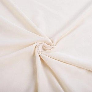 Macro detail of the creamy ivory mesh fabric texture with elegant draped folds