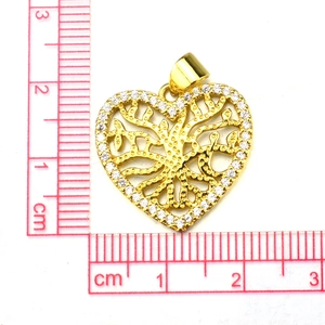 Detailed view of golden heart tree of life pendant showing 1.8cm size with a ruler