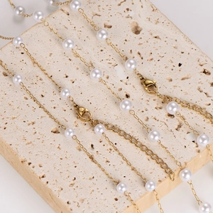 Elegant gold stainless steel chain necklace with lustrous white irregular pearls on stone
