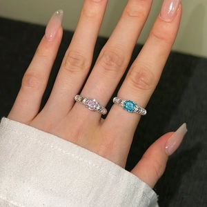 Close-up of S925 sterling silver rings with pink and blue ice flower cut gemstones