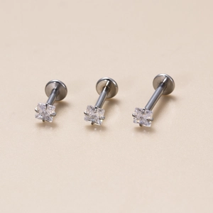 Three stainless steel labret studs with square cubic zirconia in a professional layout