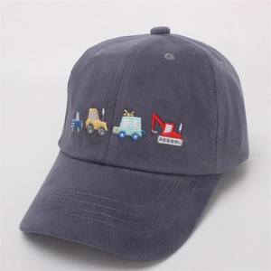 Detail of cartoon construction vehicle embroidery on dark gray cotton kids baseball cap
