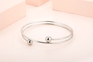Minimalist silver double-layered open cuff bracelet with polished metal bead accents