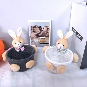 Handwoven cotton rope storage baskets with cute plush bunnies in dark gray and off-white