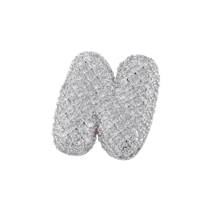 Macro shot of silver letter N pendant featuring full pavé zircon stones on white background