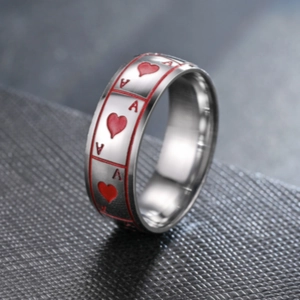 Detailed close-up shot of the vibrant red Ace of Hearts pattern on a silver titanium ring