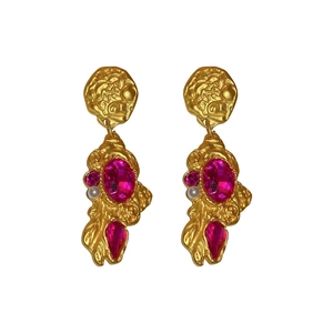 Vintage gold textured flower earrings with pink crystal and pearl accents on white background