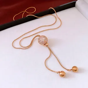 Vintage gold-plated snake chain necklace with sparkling rhinestone ball pendant
