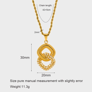 Detail of gold twisted chain necklace featuring double hoop pendants with zircon inlay