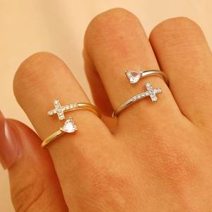 Cross and heart-shaped adjustable copper ring with zircon inlays on female hand
