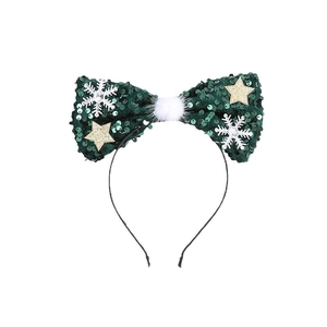 Christmas headband with large green sequin bow, white snowflakes and golden stars decor