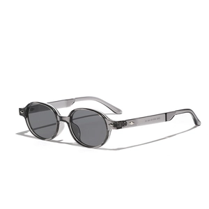 Retro oval sunglasses in translucent grey acetate frame with metal diamond accents