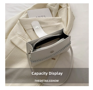 Internal view of white PU leather crossbody bag showing spacious storage for daily items