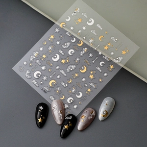 Star and moon nail stickers with metallic foil stars displayed on sample nails