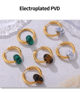 Detailed view of PVD electroplated gold hoops with tiger eye and malachite stone beads