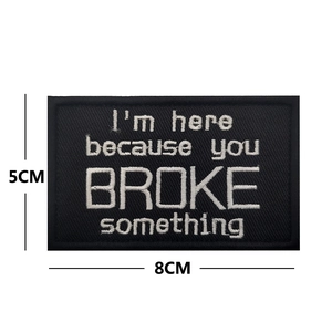 Detail view of 8x5cm black embroidered patch with motivational quote lettering