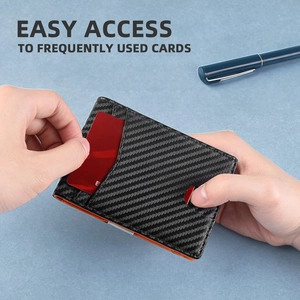 Quick access carbon fiber card holder showing a red card being pulled out easily